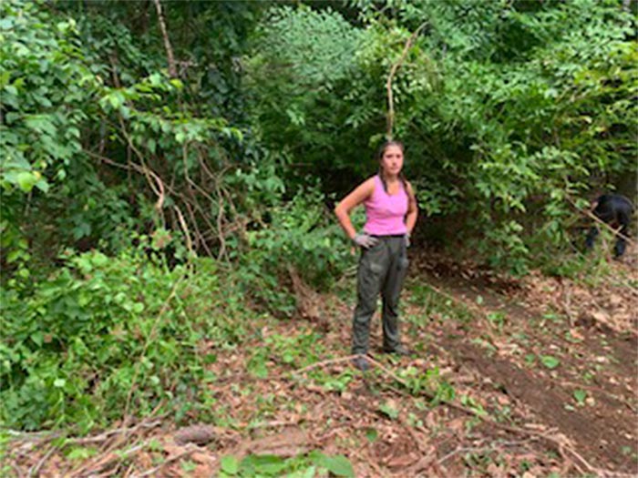 Woman Standing on the Clearing Area