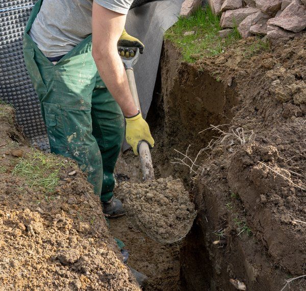 Worker Preparing for French Drains