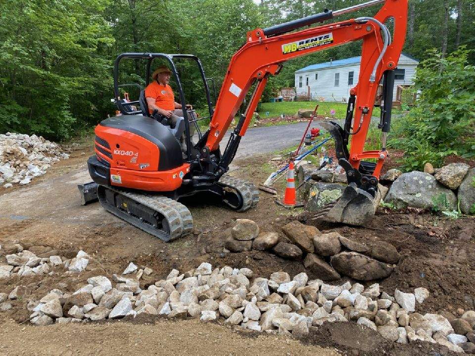 Worker Operating Excavator for New Septic Tank