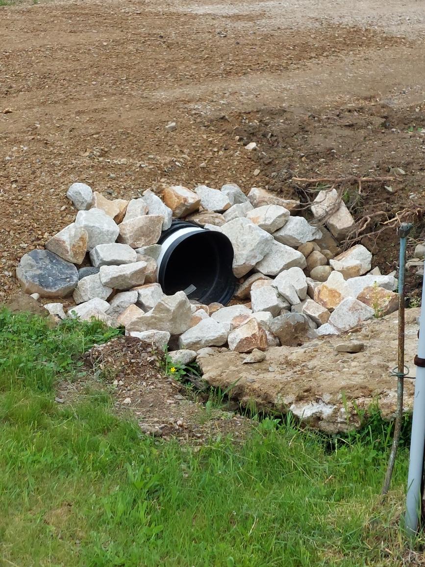 Culvert Pipe End Covered With Rocks