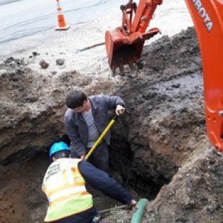 Workers Excavating Utility Line