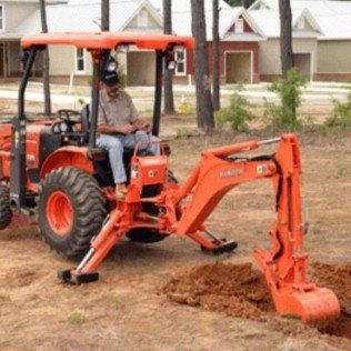 Small Backhoe Excavating Utility Line
