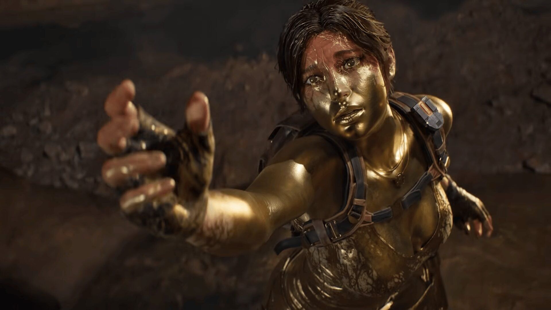 Lara Croft cubierta de lodo en una escena del tráiler de Tomb Raider: Legacy of Atlantis.