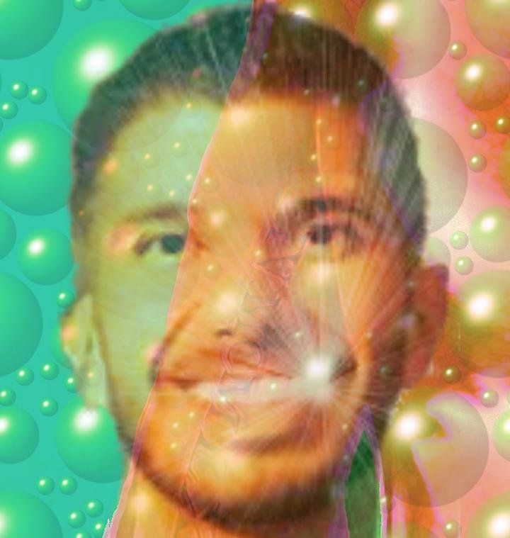 Double-exposed portrait of a smiling man over green, orange, and pink bubbles