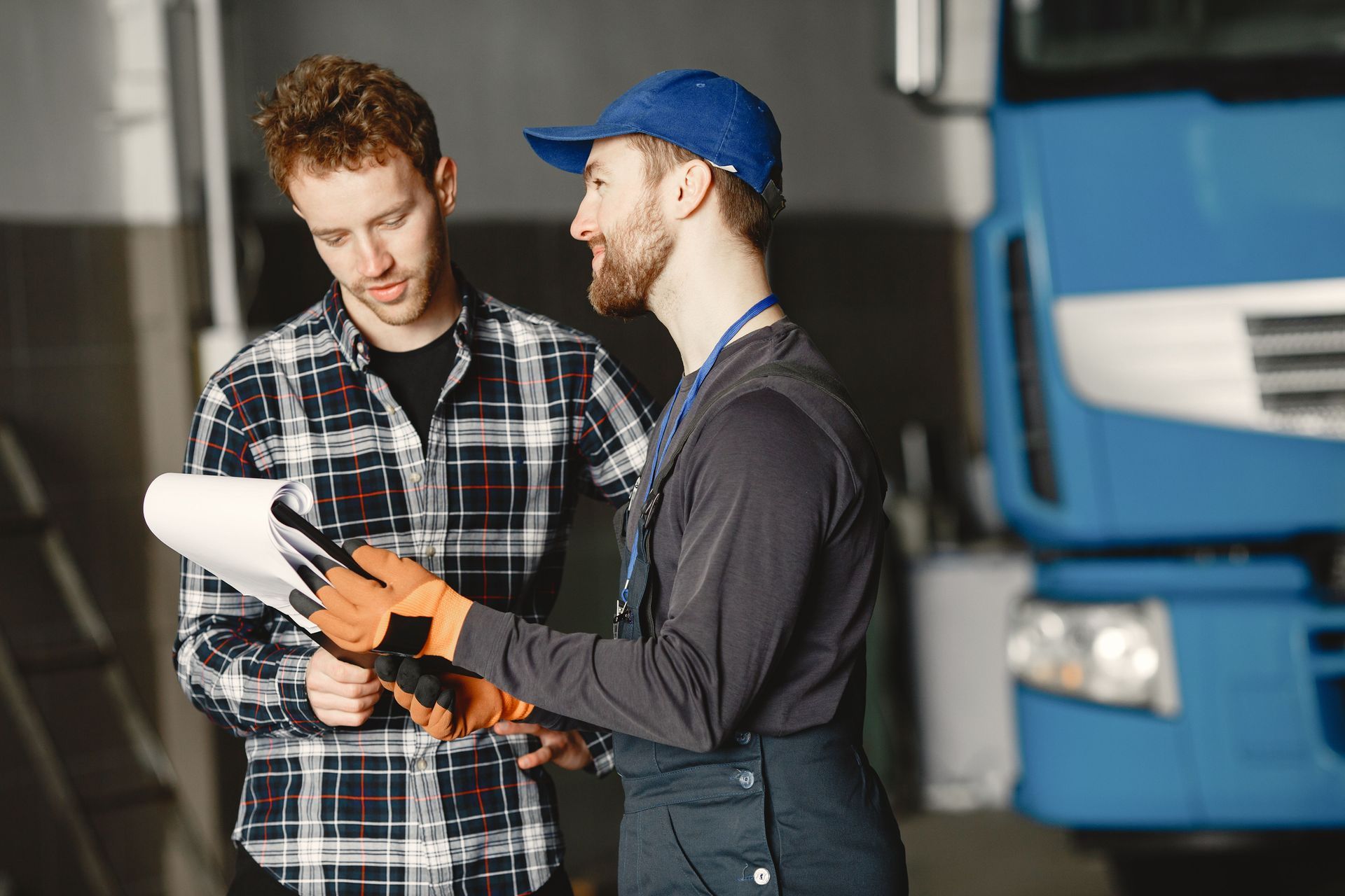 Mechanic reviewing repair estimate with customer at trusted Scottsdale auto repair shop AutoWits