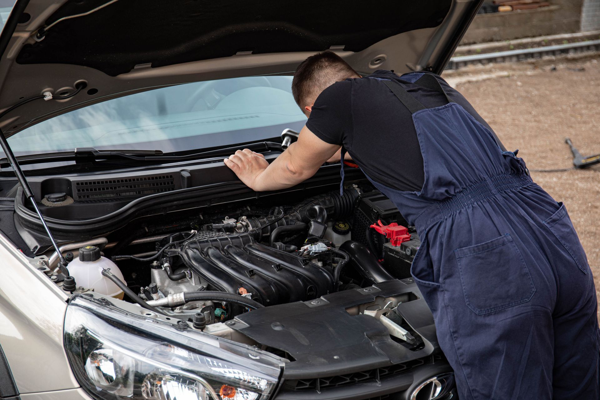 Mechanic doing seasonal car maintenance inspection at AutoWits in Scottsdale, Arizona