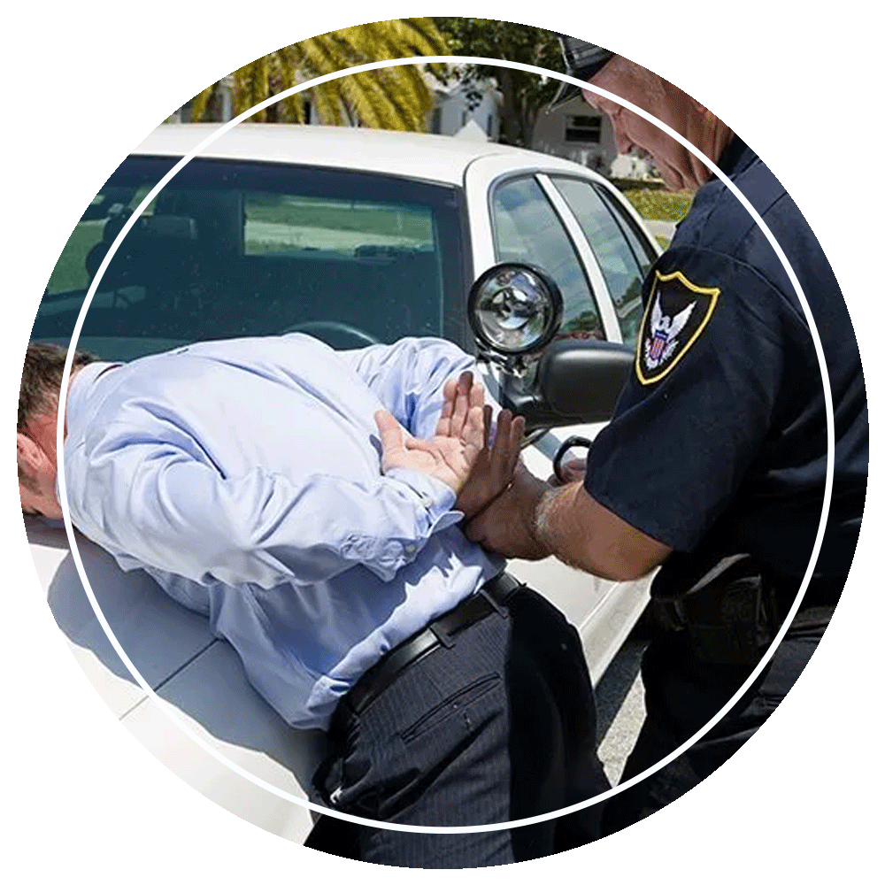 Policeman Handcuffing A Resisting Person — Eau Claire, WI — Cohen Law Offices, LLC Policeman Handcuffing A Resisting Person — Eau Claire, WI — Cohen Law Offices, LLC