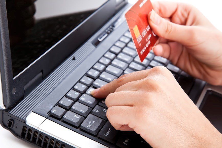 Laptop And Credit Card — Eau Claire, WI — Cohen Law Offices Laptop And Credit Card — Eau Claire, WI — Cohen Law Offices