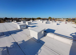 A white roof with a blue sky in the background
