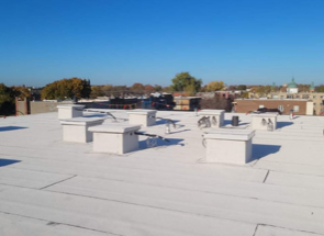 A white roof with a blue sky in the background