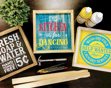A wooden sign that says `` this kitchen is for dancing '' is sitting on a table.