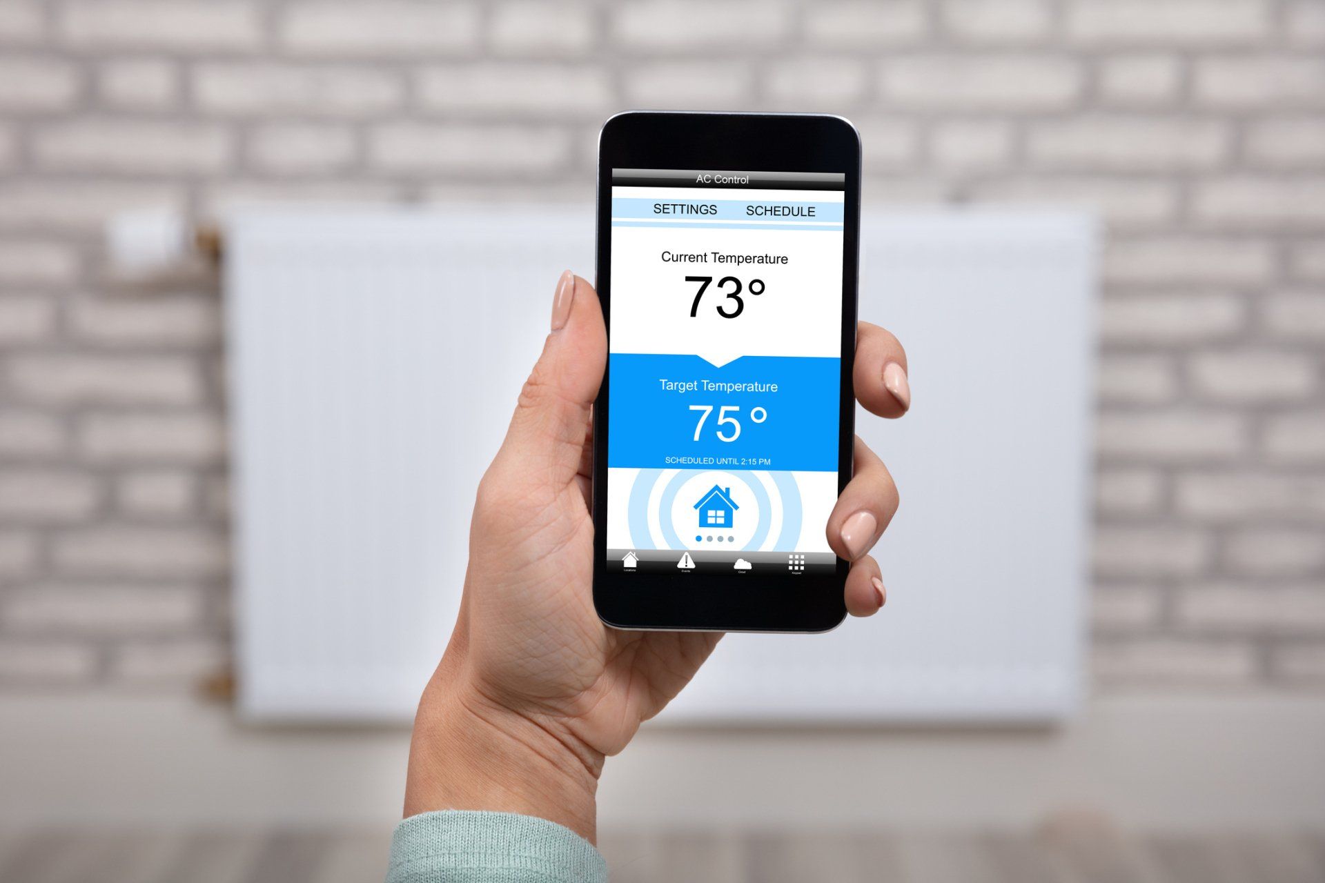 Woman operating thermostat — Toledo, OH — Diamond Heating & Air Conditioning Inc Woman operating thermostat — Toledo, OH — Diamond Heating & Air Conditioning Inc