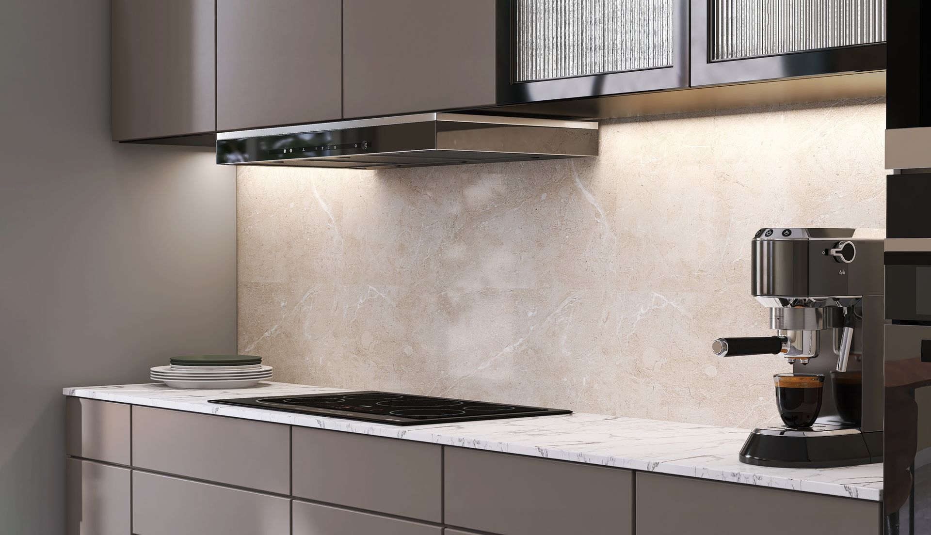 A modern kitchen with an electric stove, a white marble benchtop and a splashback.