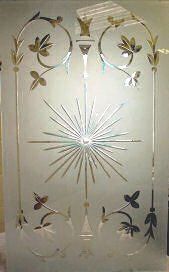 Decorative frosted glass panel with etched floral vines and a sunburst design in the center