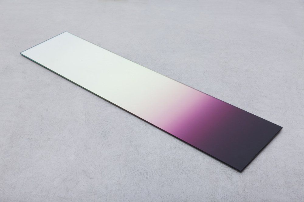 Long rectangular color swatch fading from white to pink to dark purple on a gray background