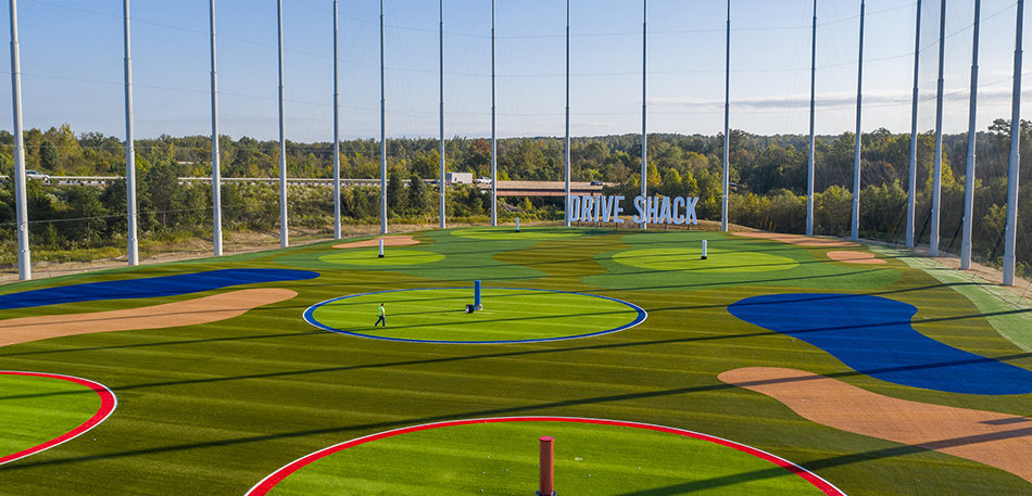 A golf driving range with the words 