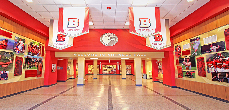 Hallway with red walls, banners with 