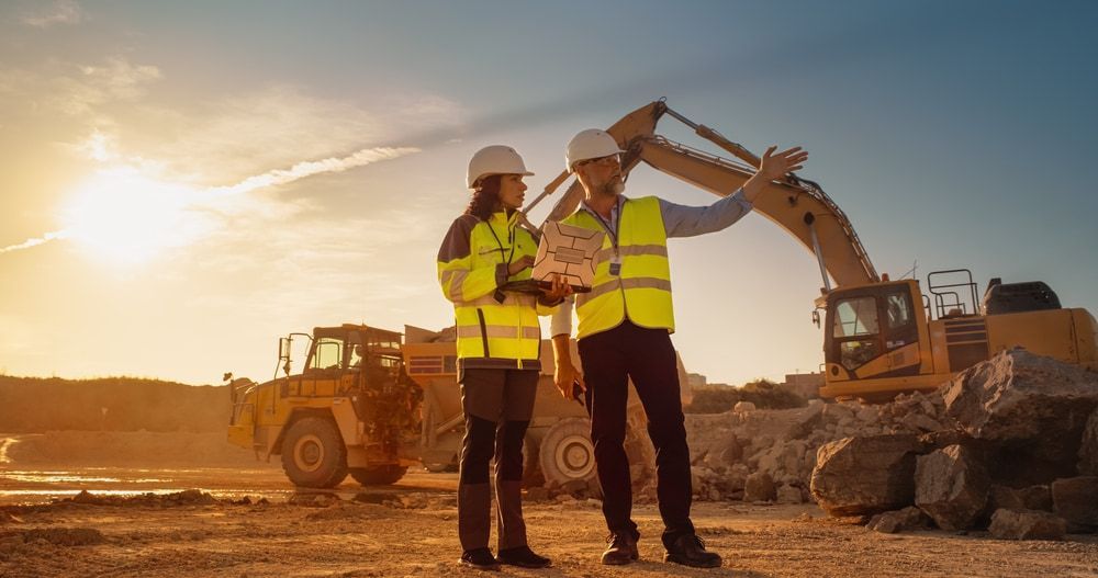 two construction workers talking