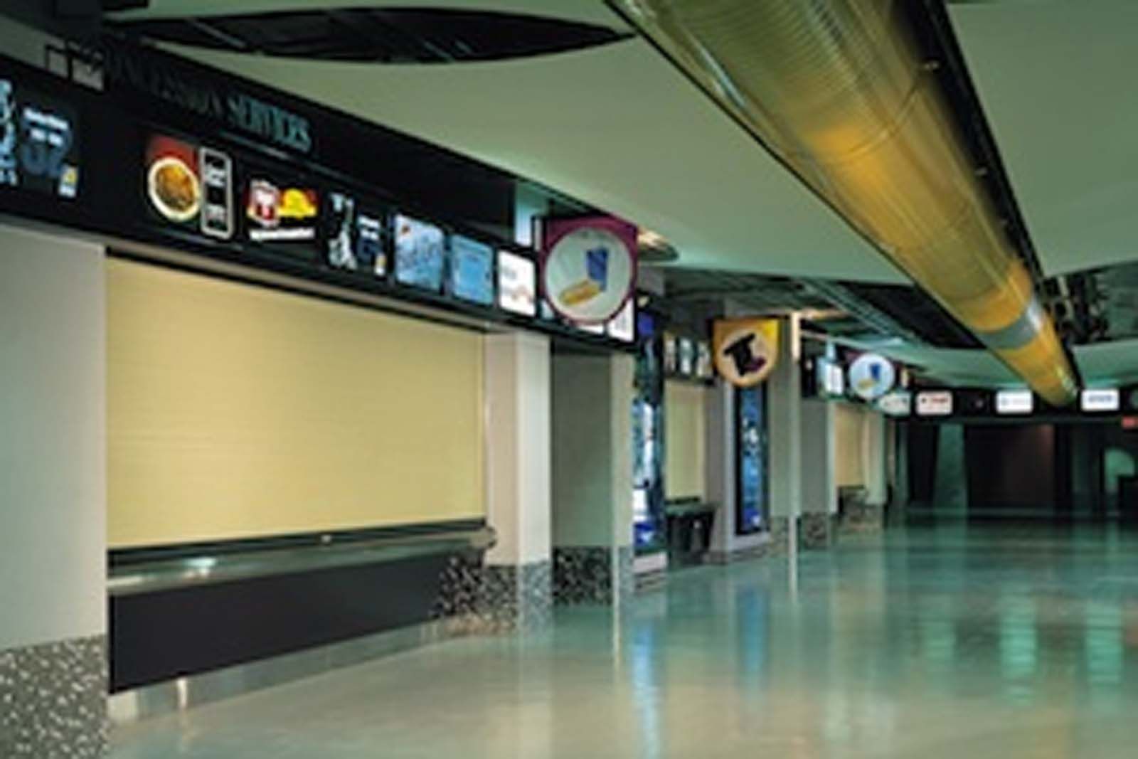 An empty hallway with a sign that says ' coca-cola ' on it