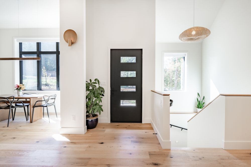 There is a black door in the middle of the room.