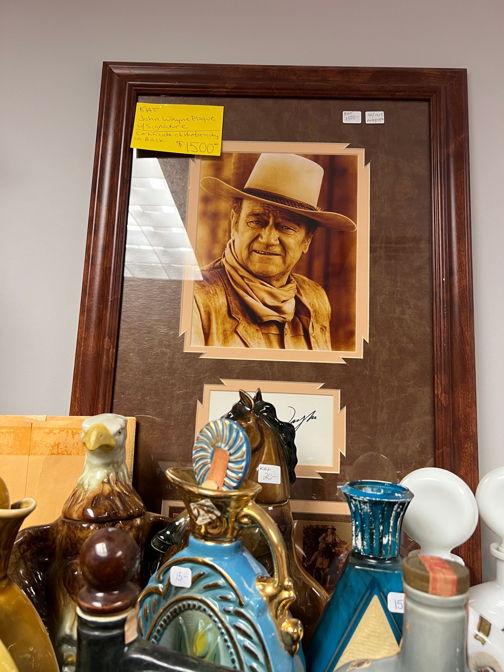 A framed picture of John Wayne