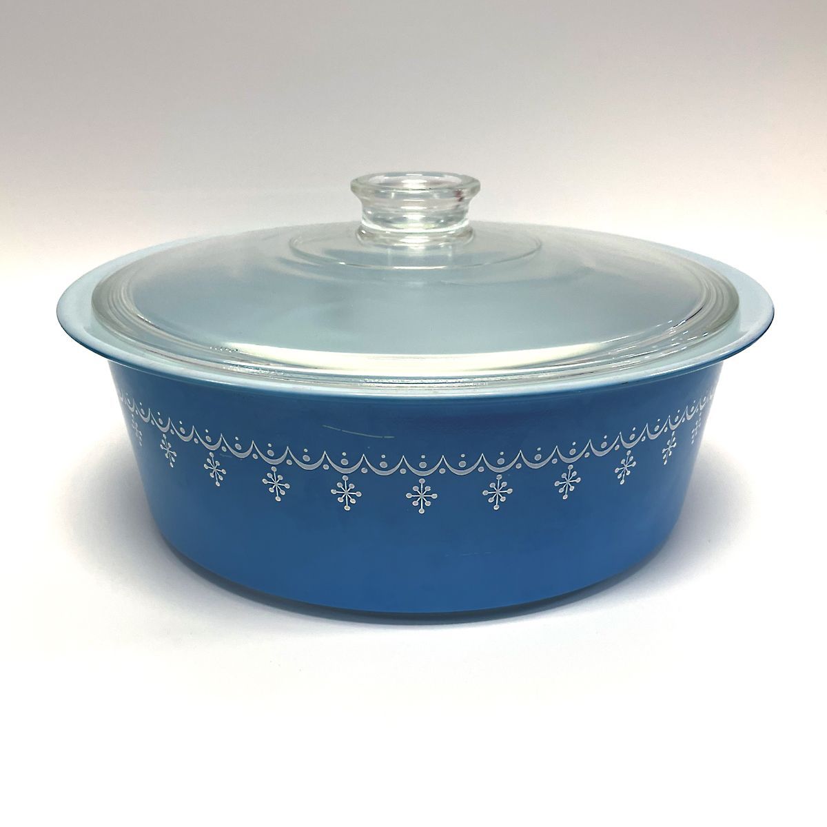 Pyrex casserole dish in snowflake scroll pattern