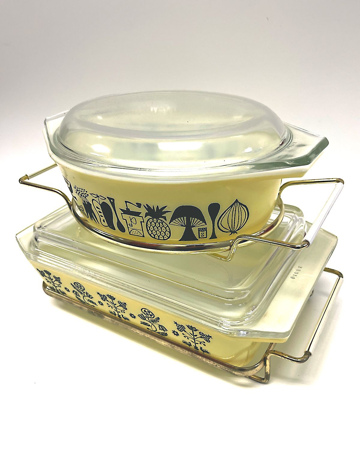 Pyrex mod kitchen and black needlepoint patterned casserole dishes