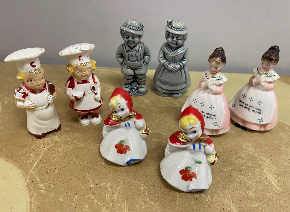 A group of figurines including a little red riding hood