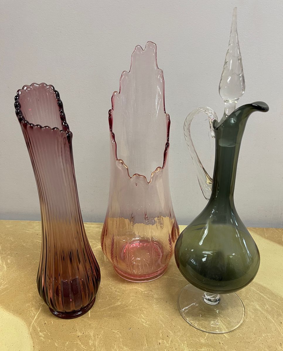 An assortment of vintage swung vases
