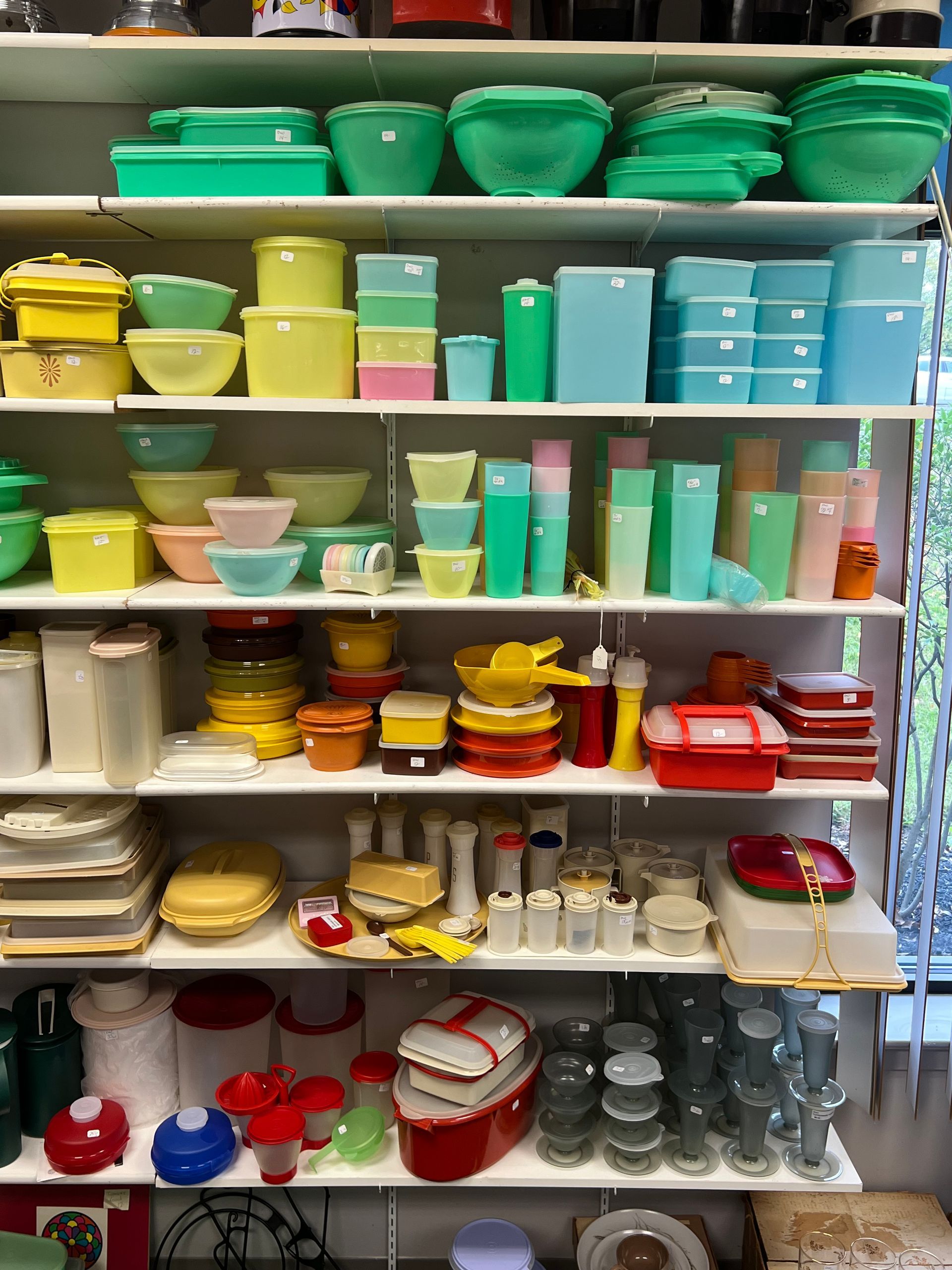 Shelves filled with a variety of bowls and containers.