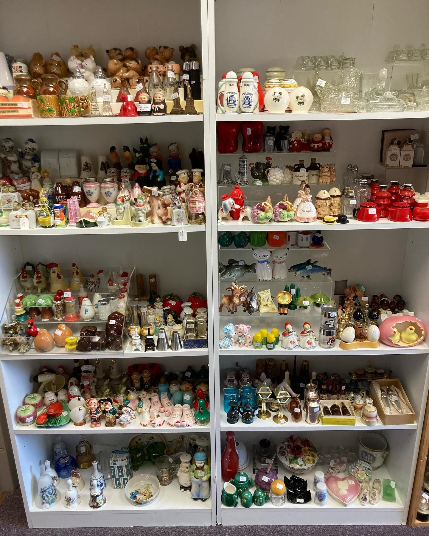 Two shelves filled with lots of christmas decorations