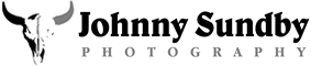 Johnny Sundby Photography logo with black longhorn skull and bold black text on white background