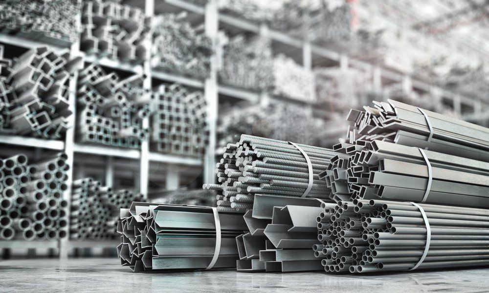 Bundles Of Metal Beams and Tubes In A Warehouse — Sheetmetal Improvements & Design in Yatala, QLD