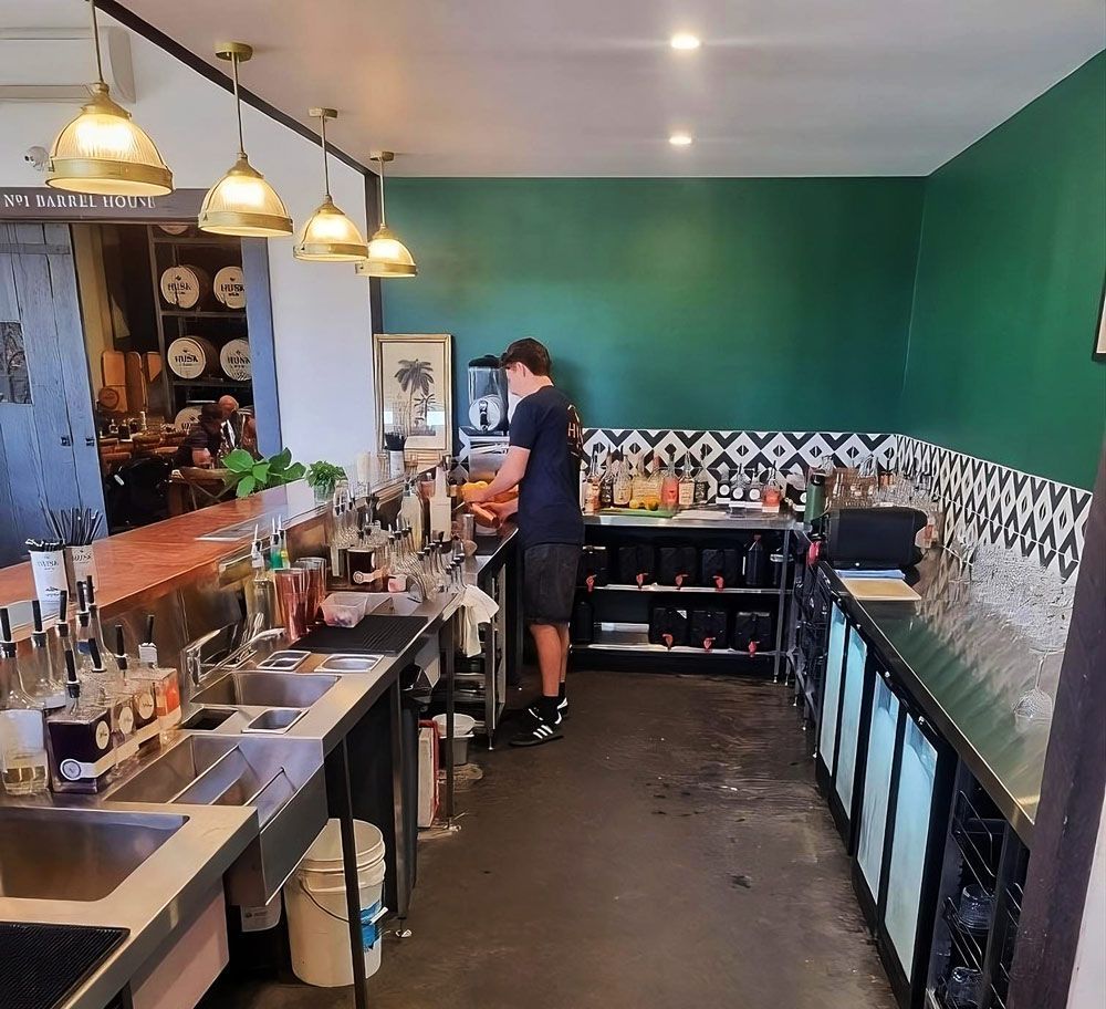 Person Preparing Drinks Behind a Bar — Sheetmetal Improvements & Design in Burleigh Heads, QLD