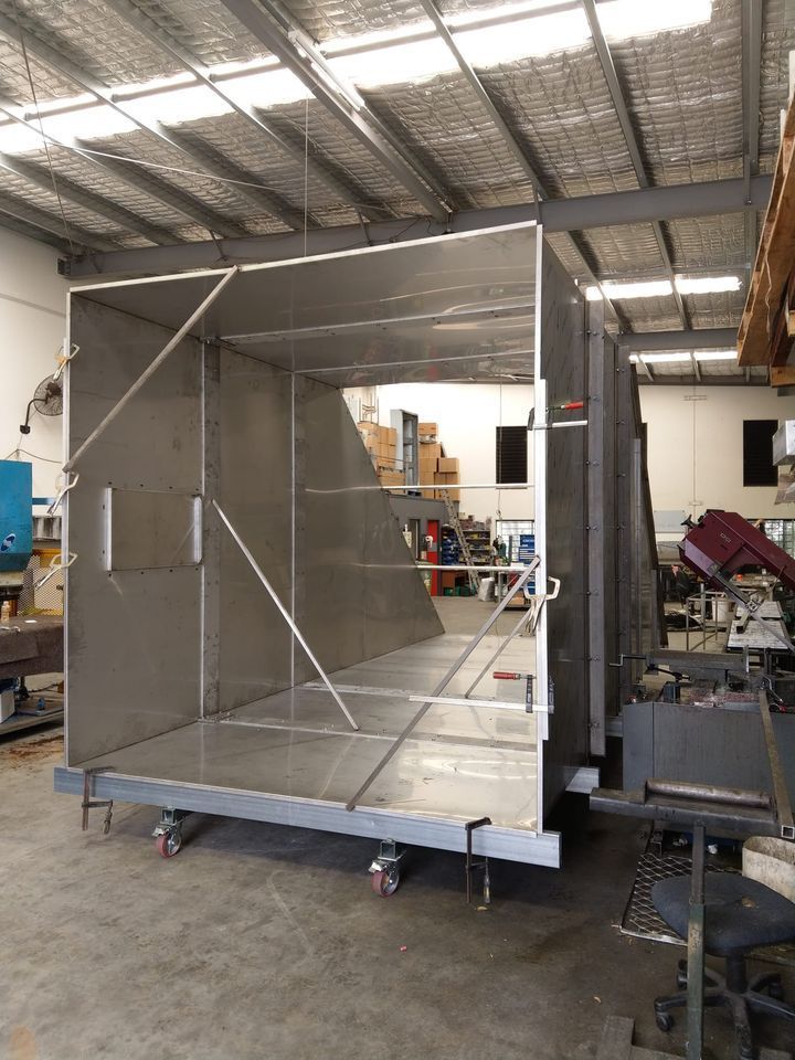 Large, Open Metal Enclosure on Wheels Inside a Workshop — Sheetmetal Improvements & Design in Burleigh Heads, QLD
