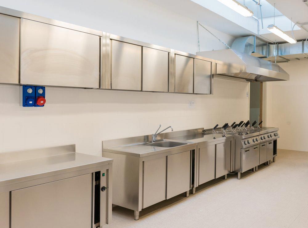Stainless Steel Commercial Kitchen With Appliances — Sheetmetal Improvements & Design in Molendinar, QLD
