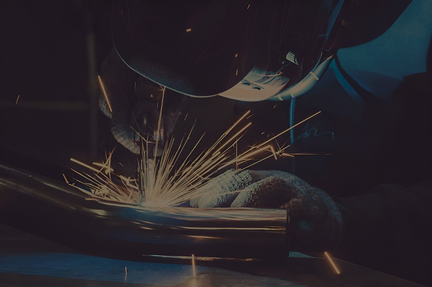 Welder Working, Sparks Flying Dark Setting — Sheetmetal Improvements & Design in Burleigh Heads, QLD