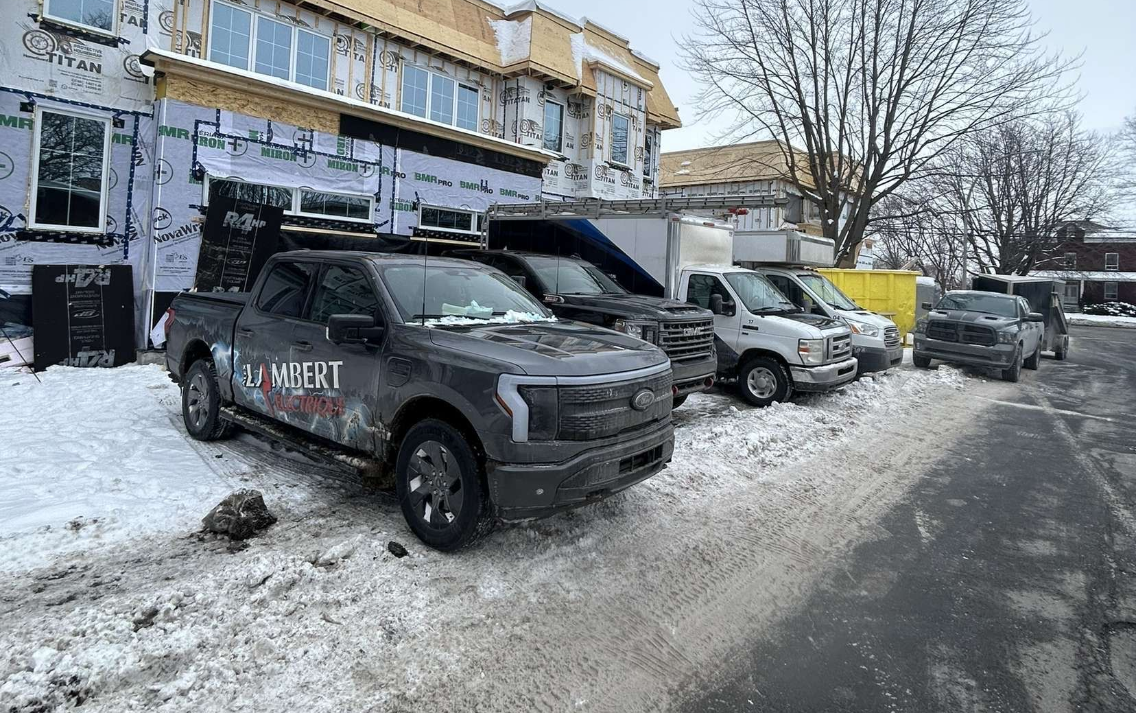 Alex Lambert Electricien vehicles parked outside building