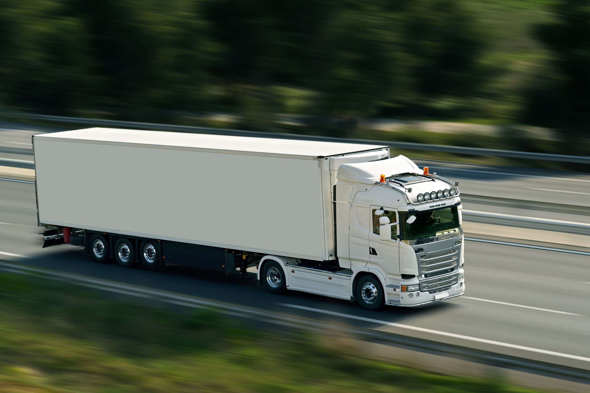 A truck with well maintained windshield on the road