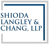Logo for Shioda Langley & Chang, LLP; dark blue text within a dark blue and gray square frame.