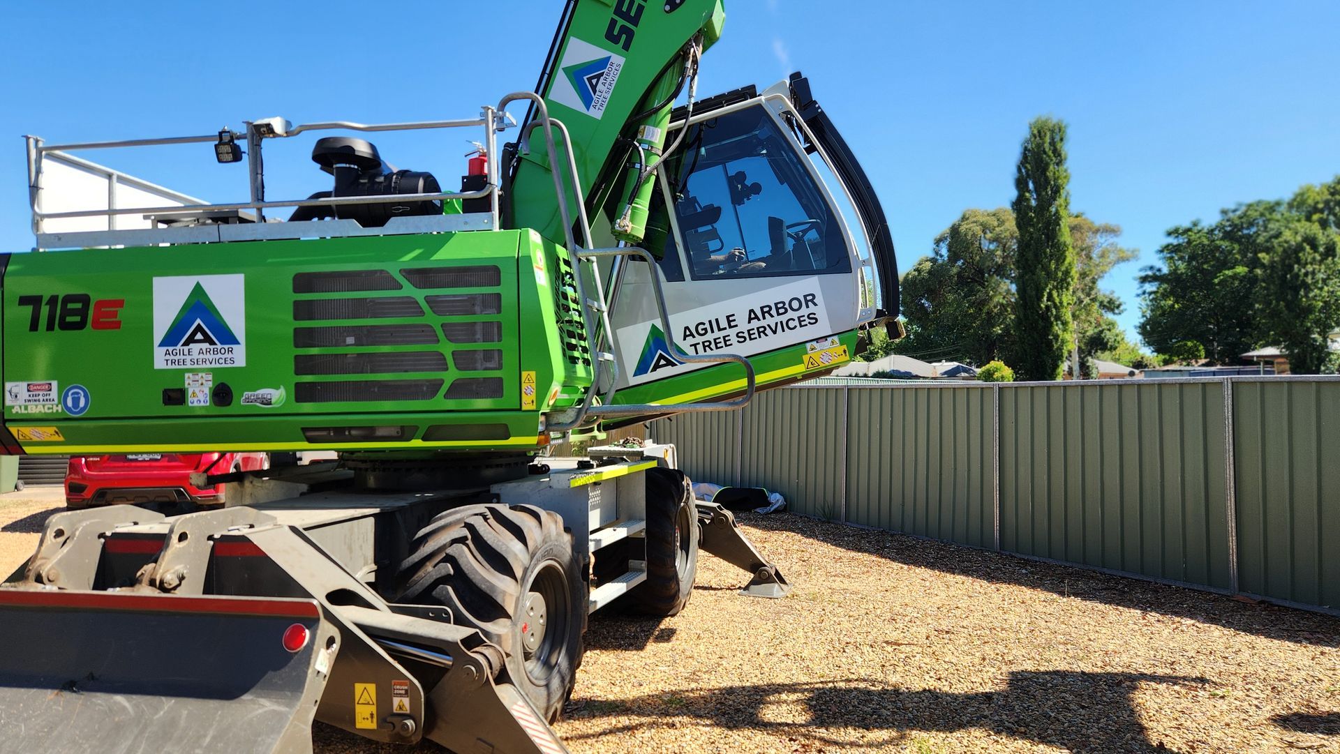 Green Sennebogen 718E parked outdoors— Agile Arbor Pty Limited in Kelso, NSW