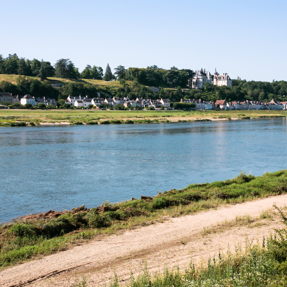 A large body of water with a castle in the background
