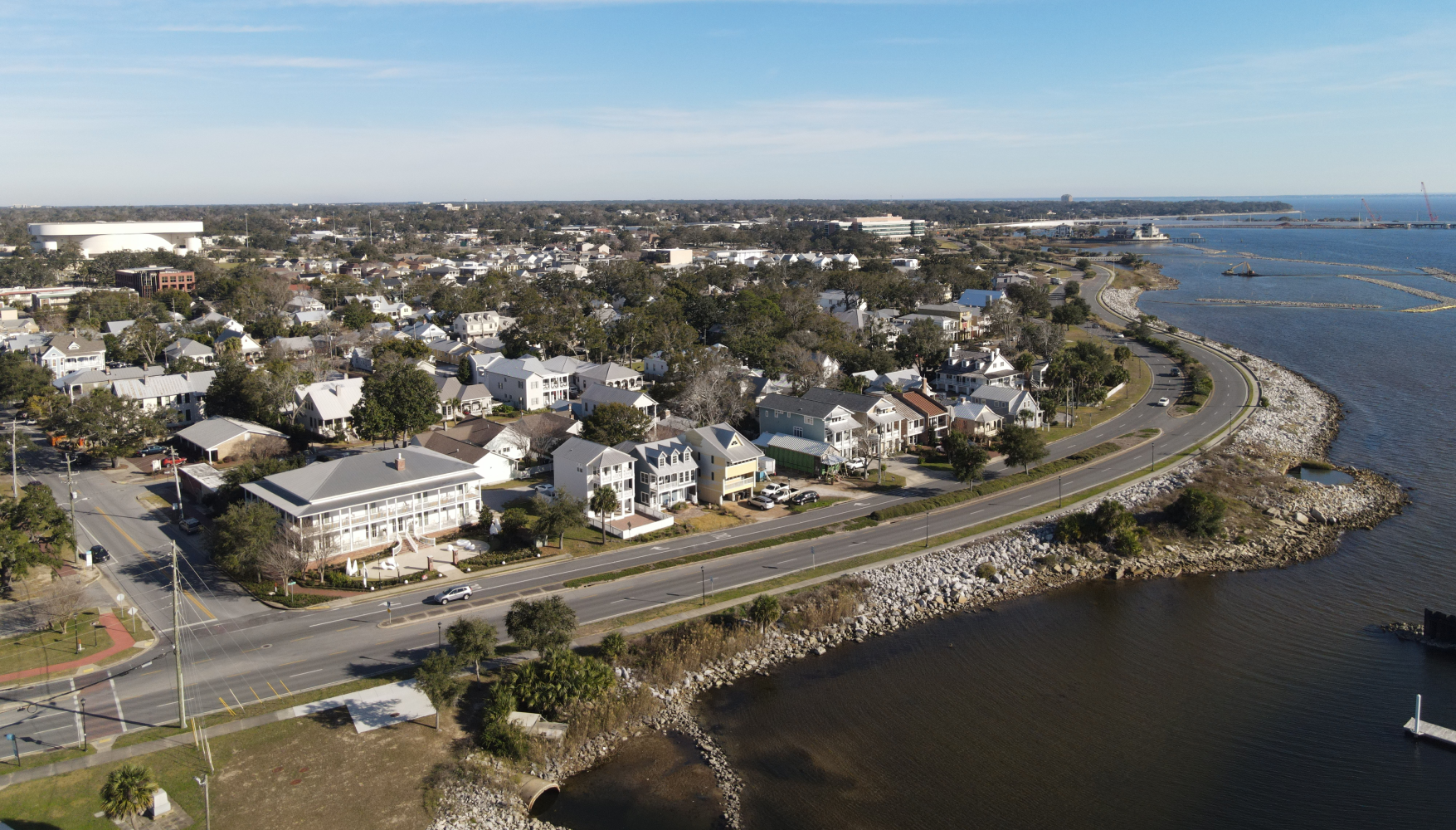 An aerial view of a small town next to a body of water.