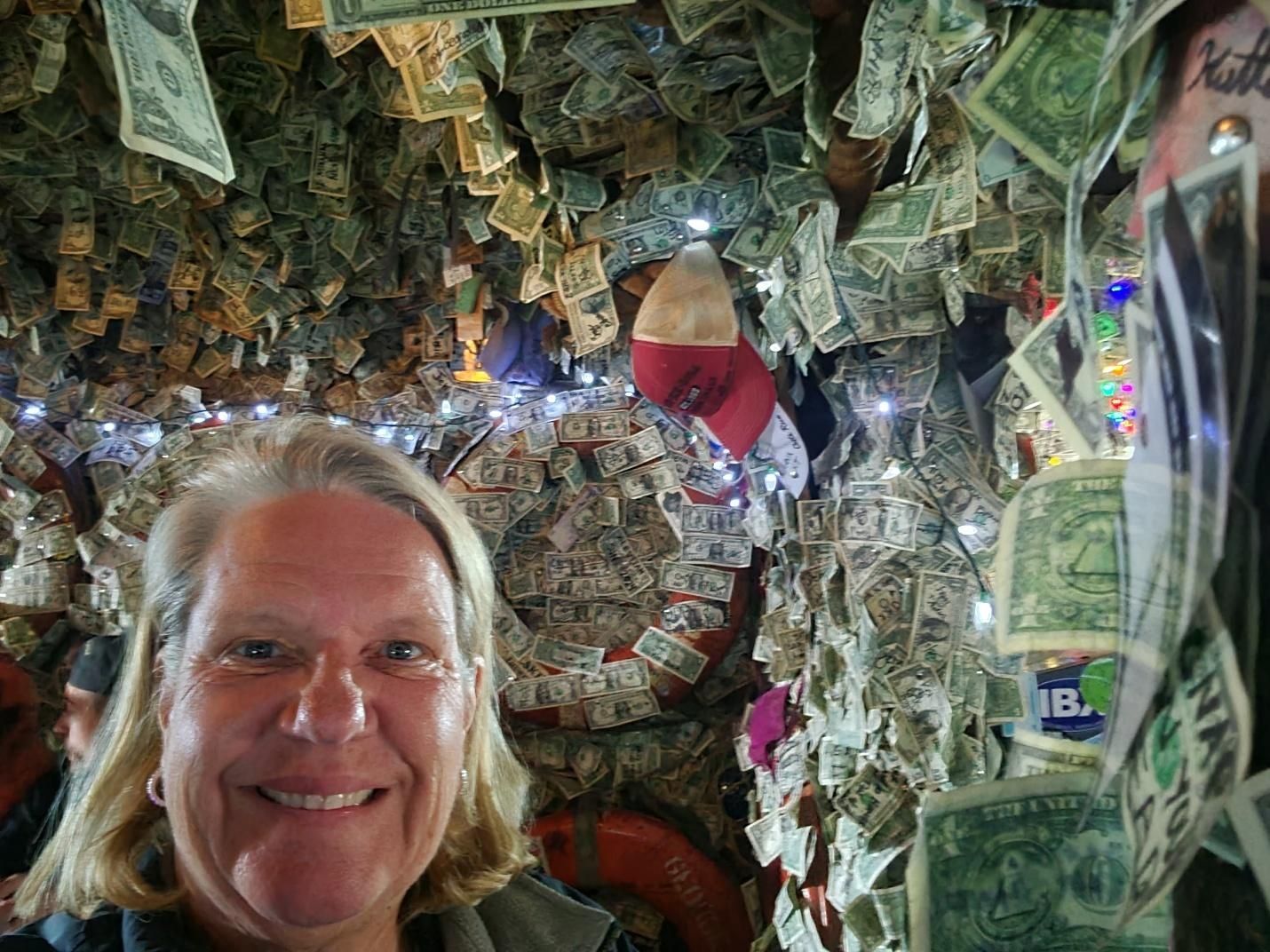 Dollar bills covering the walls and ceiling inside the Salty Dawg Saloon in Homer Alaska
