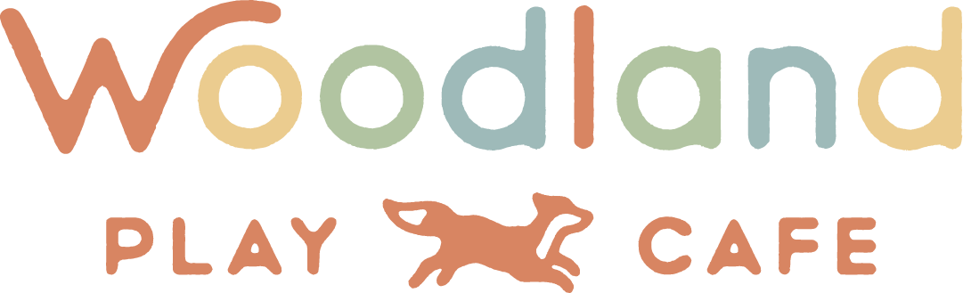 The logo for woodland play cafe with a fox on it.