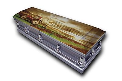 Decorative painted coffin with vintage tractor artwork on the lid, silver metal sides and latches
