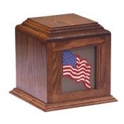 Wooden memorial urn with a recessed American flag emblem on the front