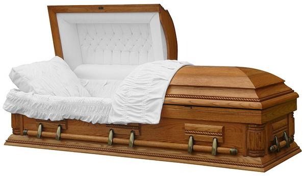 Open wooden casket with white satin lining and white bedding