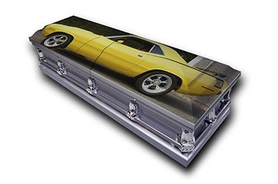 Silver coffin with a yellow sports car design on the lid