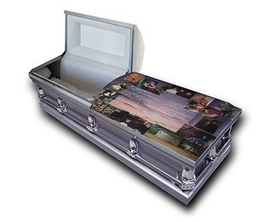 Silver casket with open lid and floral-patterned top panel
